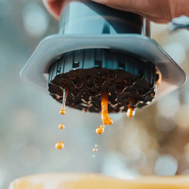 aeropress dripping into yellow mug