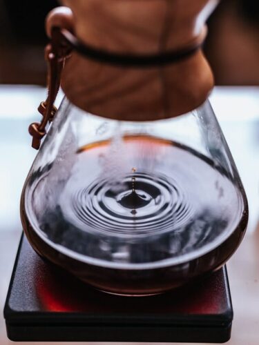 What's Pour Over Coffee? Our Favorite Brew In 5 Simple Steps 7 chemex on scale with coffee dripping