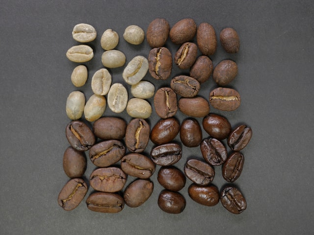 four stages of roasts of coffee in a square on grey background