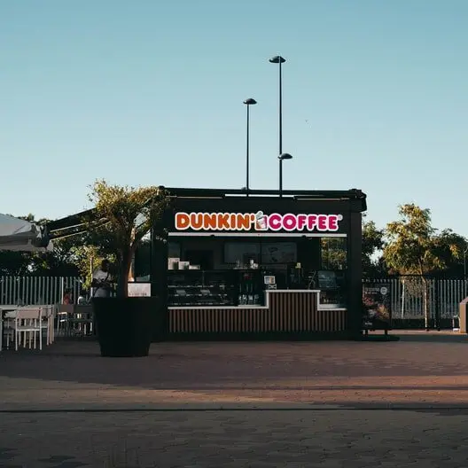 Exterior of a dunkin coffee shop at sunrise, dunkin, dunkin donuts, iced coffee from dunkin, dunkin cold brew