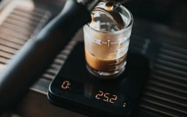 The Best Scale For Coffee: 2026 Top Picks (#1 May Surprise You) 1 close up of espresso shot brewing on acaia scale, best coffee scale