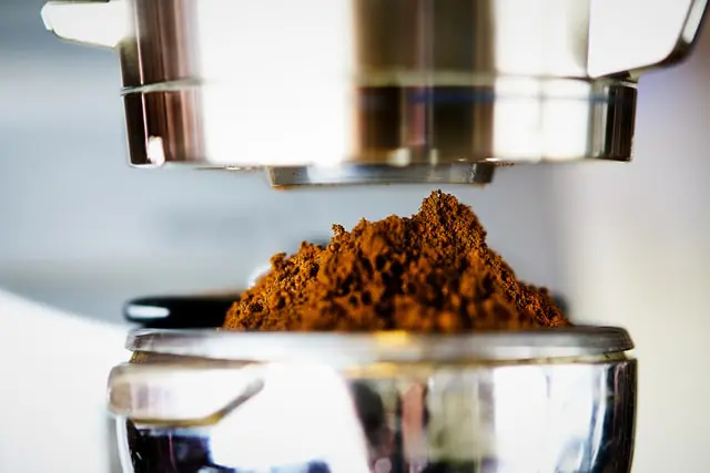 The 5 Best Manual Coffee Grinders In 2026: Brew Better Coffee 8 coffee grounds in portafilter close up