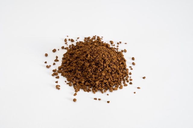 small pile of instant coffee granules on a white surface, Recipe for instant coffee
Caffeine in instant coffee
