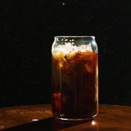 What Are The Best Coffee Beans For Cold Brew? Try 1 Of These 4 cold brew on wooden table with black background, best coffee beans for cold brew