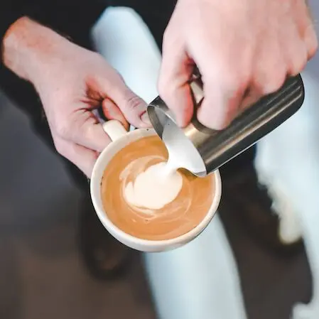 pouring milk into espresso, what is a breve