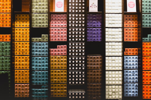 shelves of Nespresso pods in colored boxes