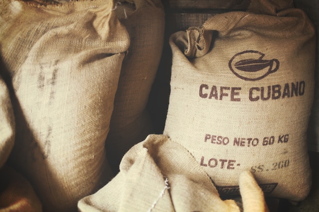 cafe cubano coffee beans in burlap sacks 