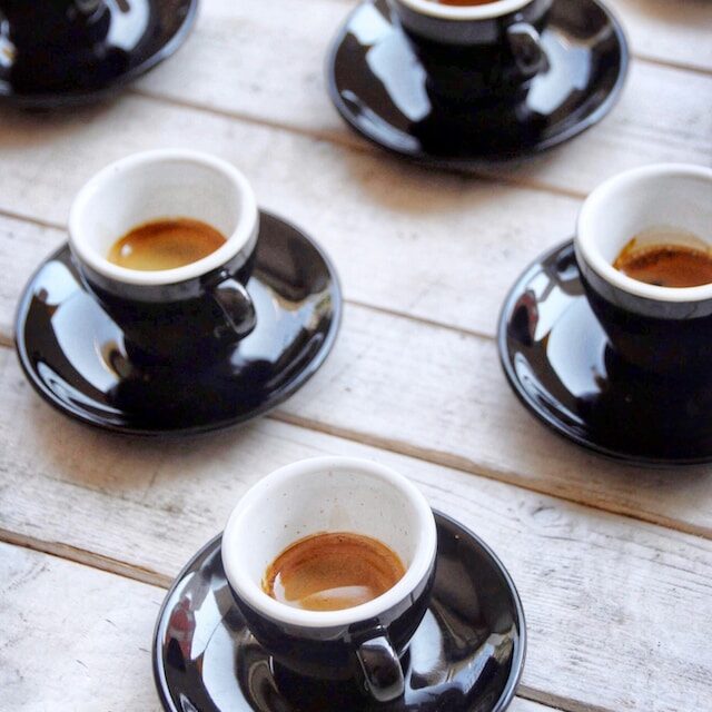 small black espresso cups with colada coffees
