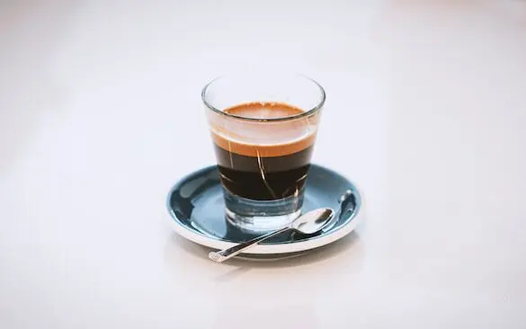 How Much Caffeine is in a Shot of Espresso? +5 Proven Facts 1 espresso in glass with spoon, how much caffeine is in a shot of espresso